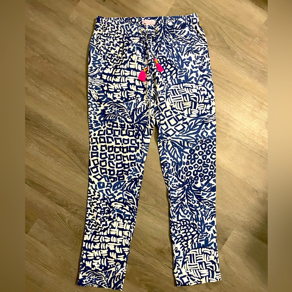 Lilly Pulitzer royal blue and white pants with hot coral/ pink tassel.